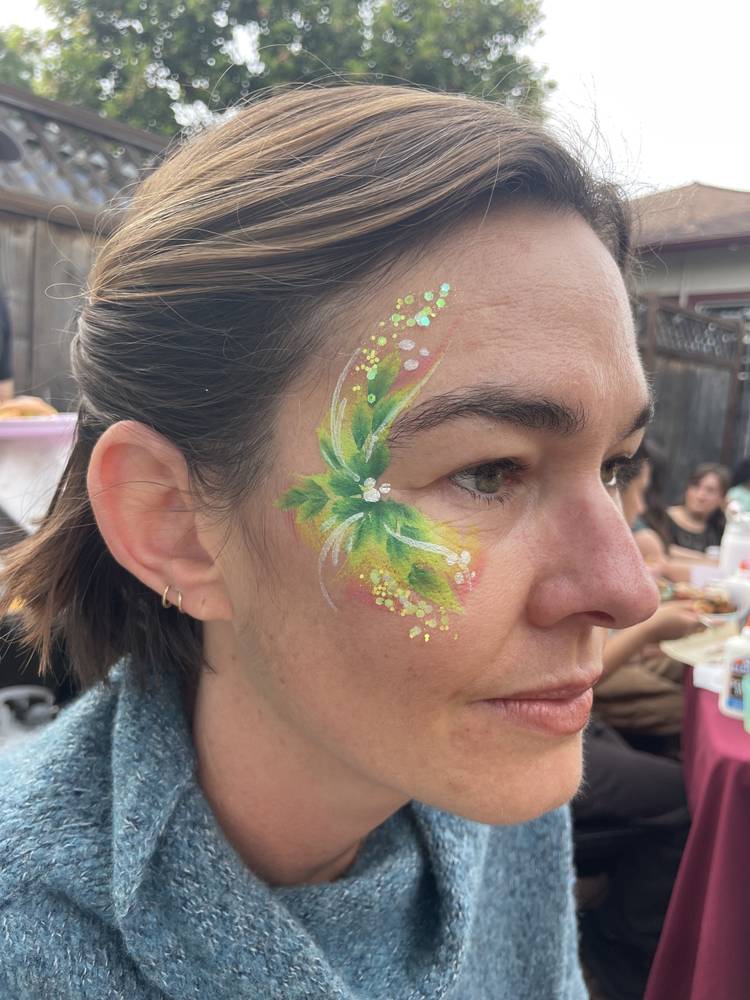 Green leaf glitter cheek design